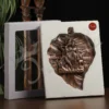 Copper Finish Radha Krishna Leaf Wall Hanging in a leaf shaped design