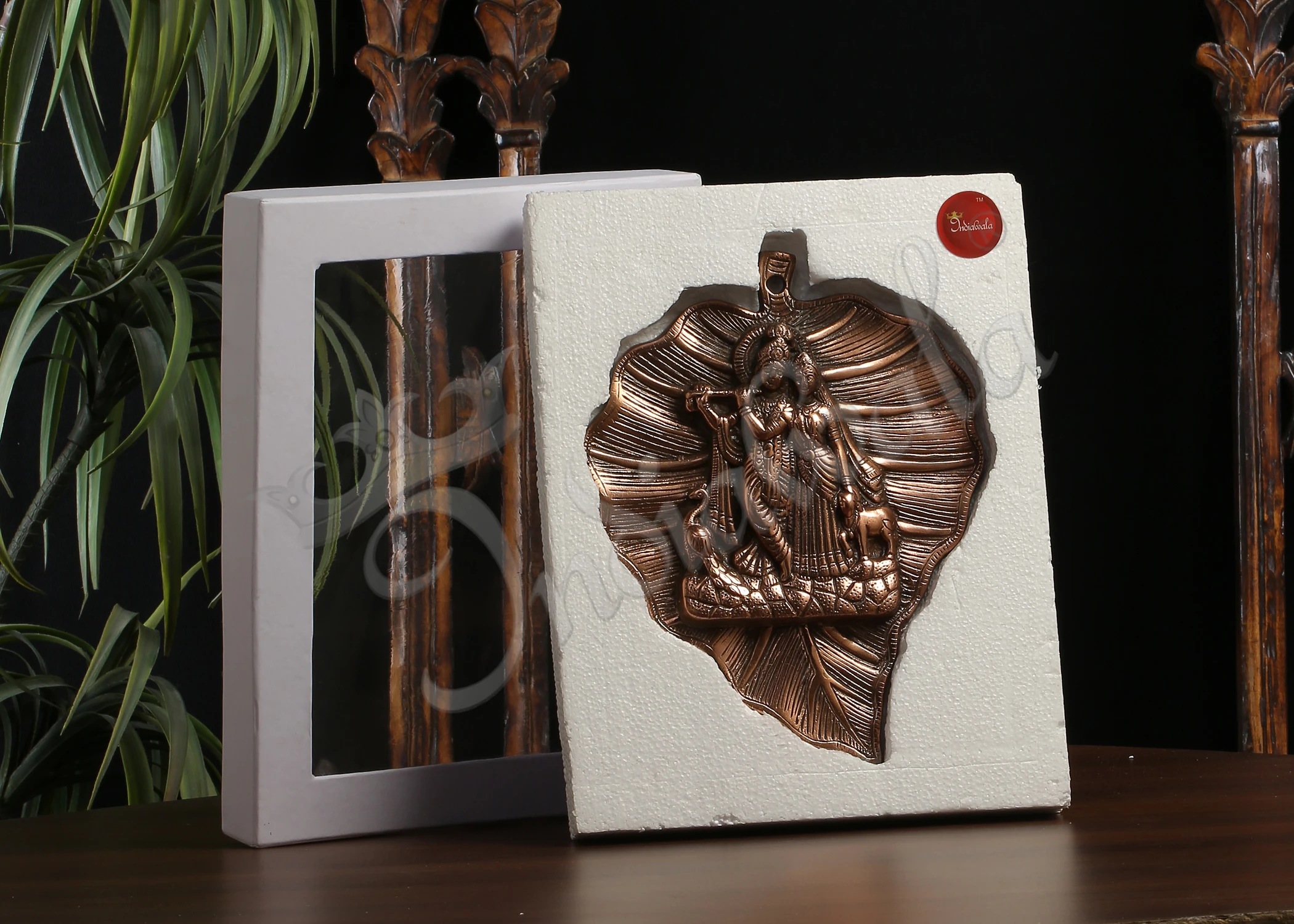 INW-10040 Copper Finish Radha Krishna Leaf Wall Hanging in a leaf shaped design