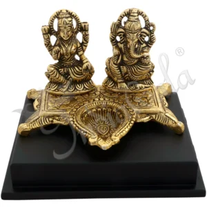 Gold plated aluminium Lakshmi Ganesh Wooden Base with integrated diya for festive gifting.