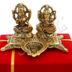 A 5x5 inch Gold Plated Aluminium Deep Lakshmi Ganesh Gift in a velvet box, perfect for auspicious occasions.