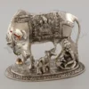 An 8 Inch Gold Plated Aluminium Kamdhenu Cow Calf Laddu Gopal statue, beautifully crafted.