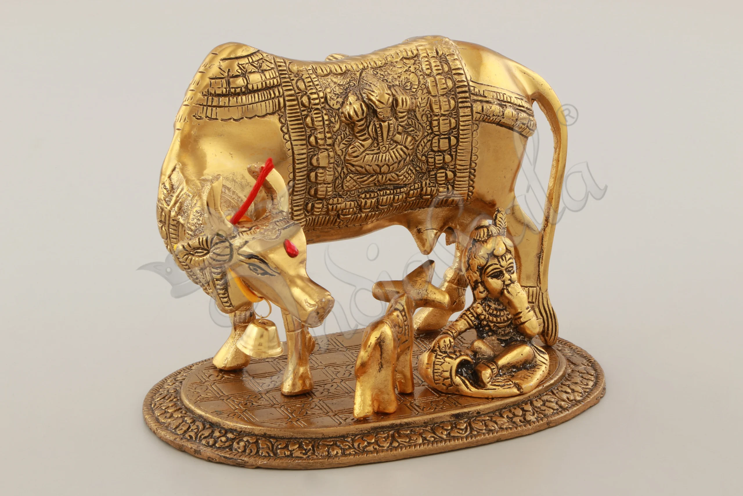 INW-15062 A beautifully crafted Gold Plated Aluminium Cow Calf Laddu Gopal statue for spiritual home decor.
