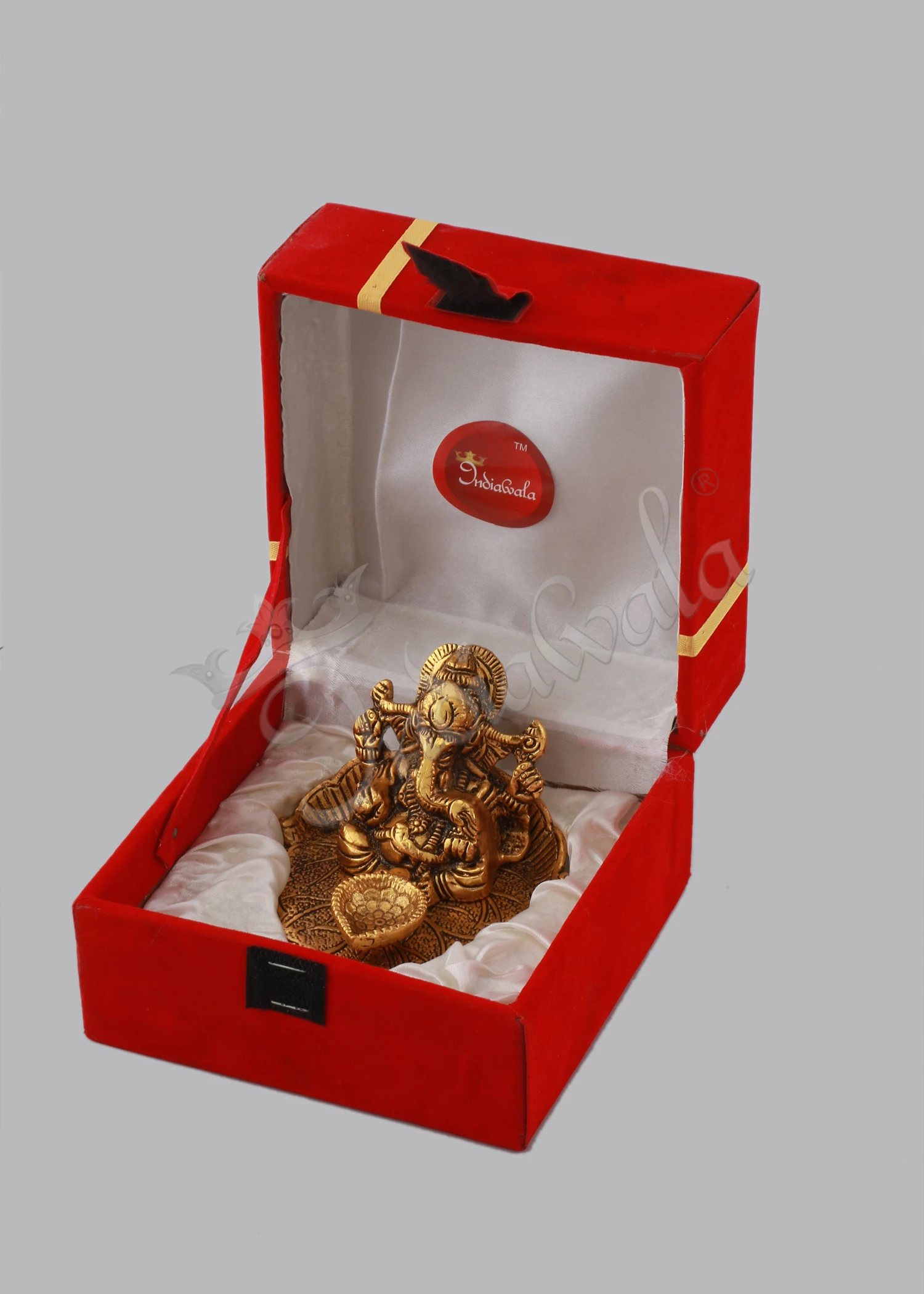 INW-15065 A beautiful 3.75 inch Gold Plated Aluminium Patta Deep Ganesh Velvet Box, showcasing intricate details.