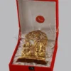 A 6.75 Inch Gold Plated Aluminium Tree Lakshmi Ganesh Gift in a velvet box, showcasing intricate details.