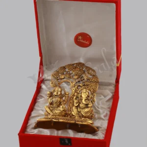 A 6.75 Inch Gold Plated Aluminium Tree Lakshmi Ganesh Gift in a velvet box, showcasing intricate details.