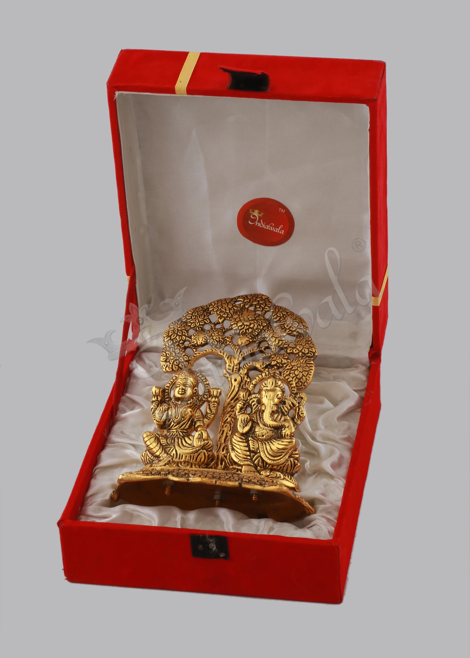 INW-15066 A 6.75 Inch Gold Plated Aluminium Tree Lakshmi Ganesh Gift in a velvet box, showcasing intricate details.