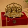 An 8 inch Gold Plated Aluminium Lakshmi Ganesh Saraswati Velvet Box, featuring intricate details of the deities.