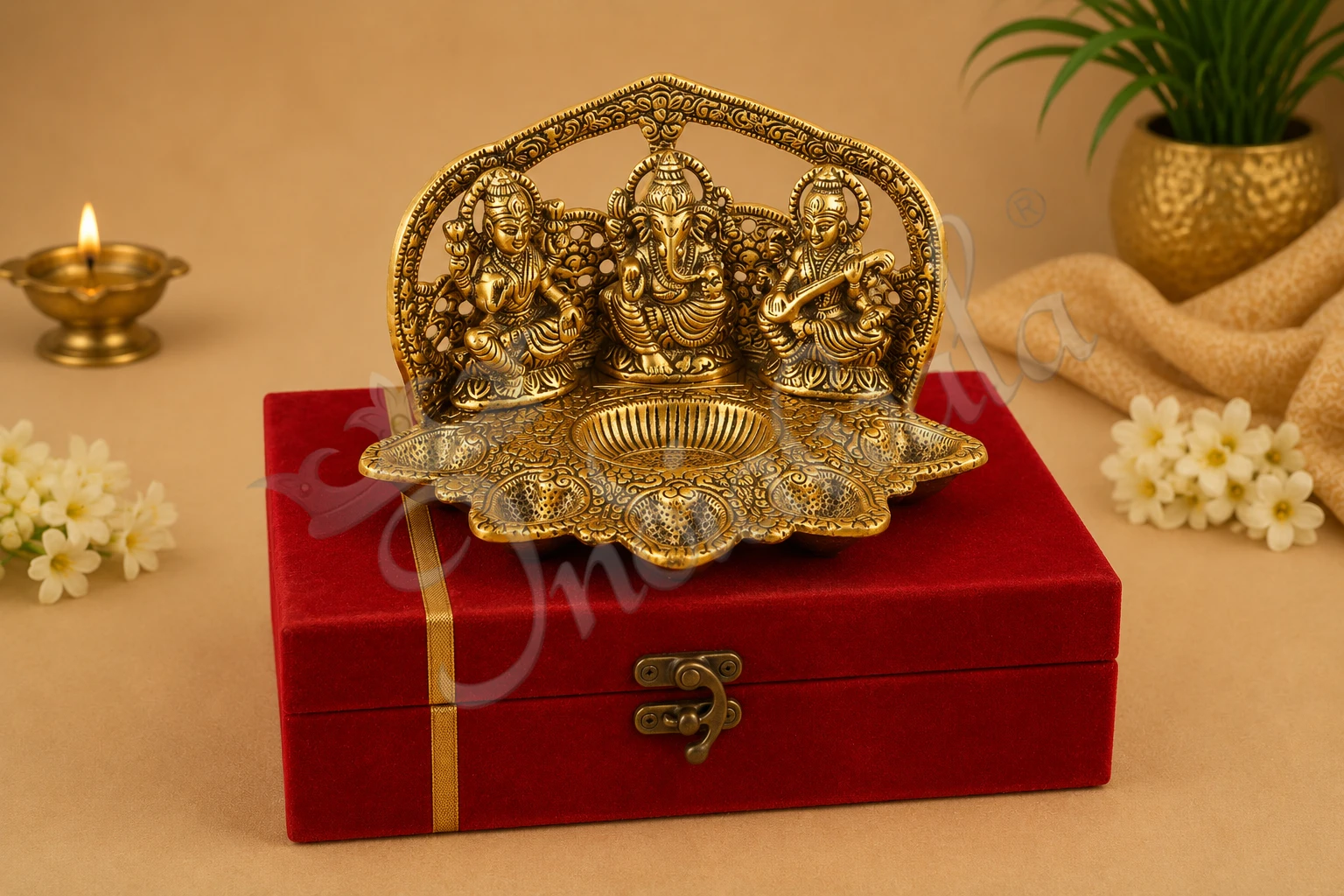 INW-15155 An 8 inch Gold Plated Aluminium Lakshmi Ganesh Saraswati Velvet Box, featuring intricate details of the deities.