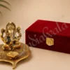 A beautiful Gold Plated Aluminium Patta Deep Ganesh Gift in a velvet box.