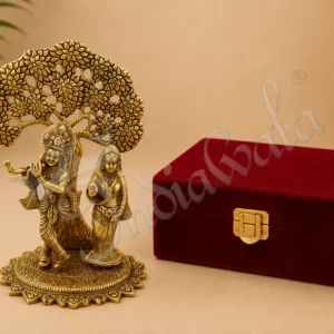 An 8.5 Inch Gold Plated Aluminium Radha Krishna Tree Gift, elegantly crafted and presented in a velvet box.