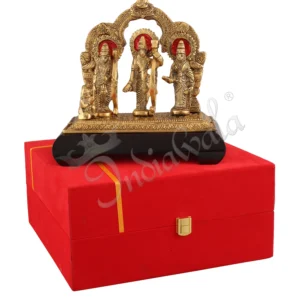 A beautifully crafted 9 inch Gold Plated Aluminium Ram Darbar Idol on a wooden base.