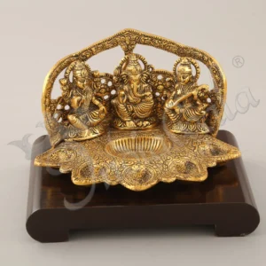 Gold Plated Deep Lakshmi Ganesh Saraswati statue on a wooden base