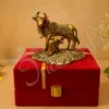 Gold Plated Kamdhenu Cow Calf Velvet Box featuring a handcrafted gold plated aluminium cow and calf statue.