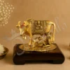 Gold Plated Kamdhenu Cow Calf Laddu Gopal Gift on a wooden base
