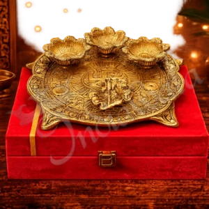 An 8.5 Inch Gold Plated Aluminium Gifting Pooja Thali with Velvet Box, showcasing its elegant design.