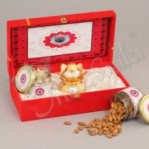 Elegant gold plated aluminium kalash bowl gift set in a red velvet box.