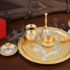 A beautifully handcrafted 10 Inch Gold Plated Aluminium Pooja Thali, showcasing its radiant finish.
