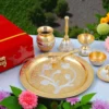 An 8 inch gold plated aluminium pooja thali, beautifully crafted for religious ceremonies.