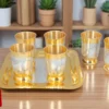 Dual tone steel six glass set with velvet box on a square tray