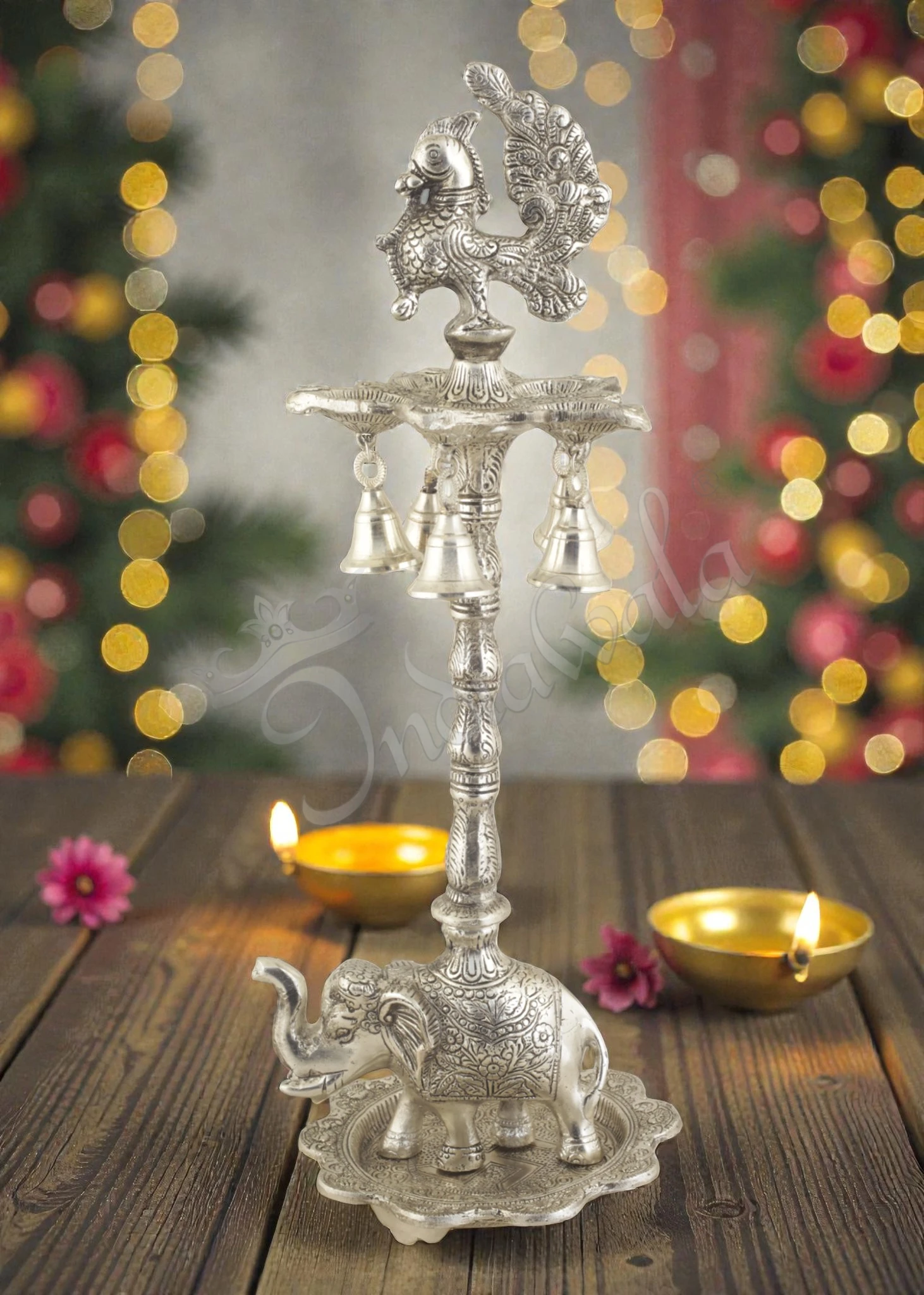 INW-15407 A beautiful 17.5 Inch Silver Plated Aluminium Elephant Peacock Diya stand with intricate details.