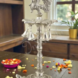 A beautiful 15 Inch Silver Plated Aluminium Peacock Tortoise Diya Stand with intricate detailing.