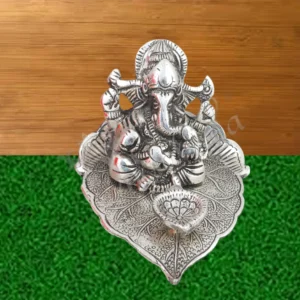 Silver Plated Aluminium Leaf Ganesh Statue with integrated diya for festive gifting.