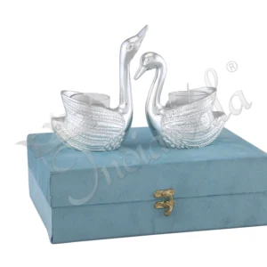 A pair of elegant Gifting Silver Plated Aluminium Swan T-Light Holder Set, presented in a velvet box.