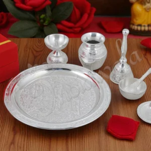 An 8 Inch Swastik Silver Plated Aluminium Pooja Thali with intricate design.