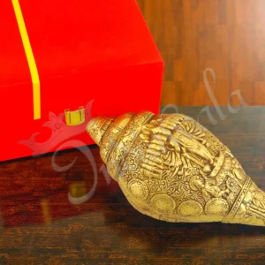 A beautifully crafted 9 inch brass gold plated shankh, presented in a velvet box.