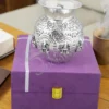 A beautifully handcrafted 4.75 inch silver plated brass Lakshmi pooja lota in a velvet box.