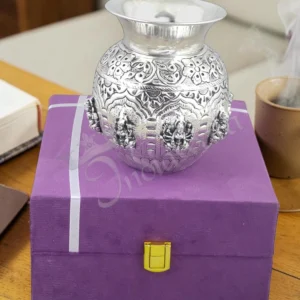 A beautifully handcrafted 4.75 inch silver plated brass Lakshmi pooja lota in a velvet box.