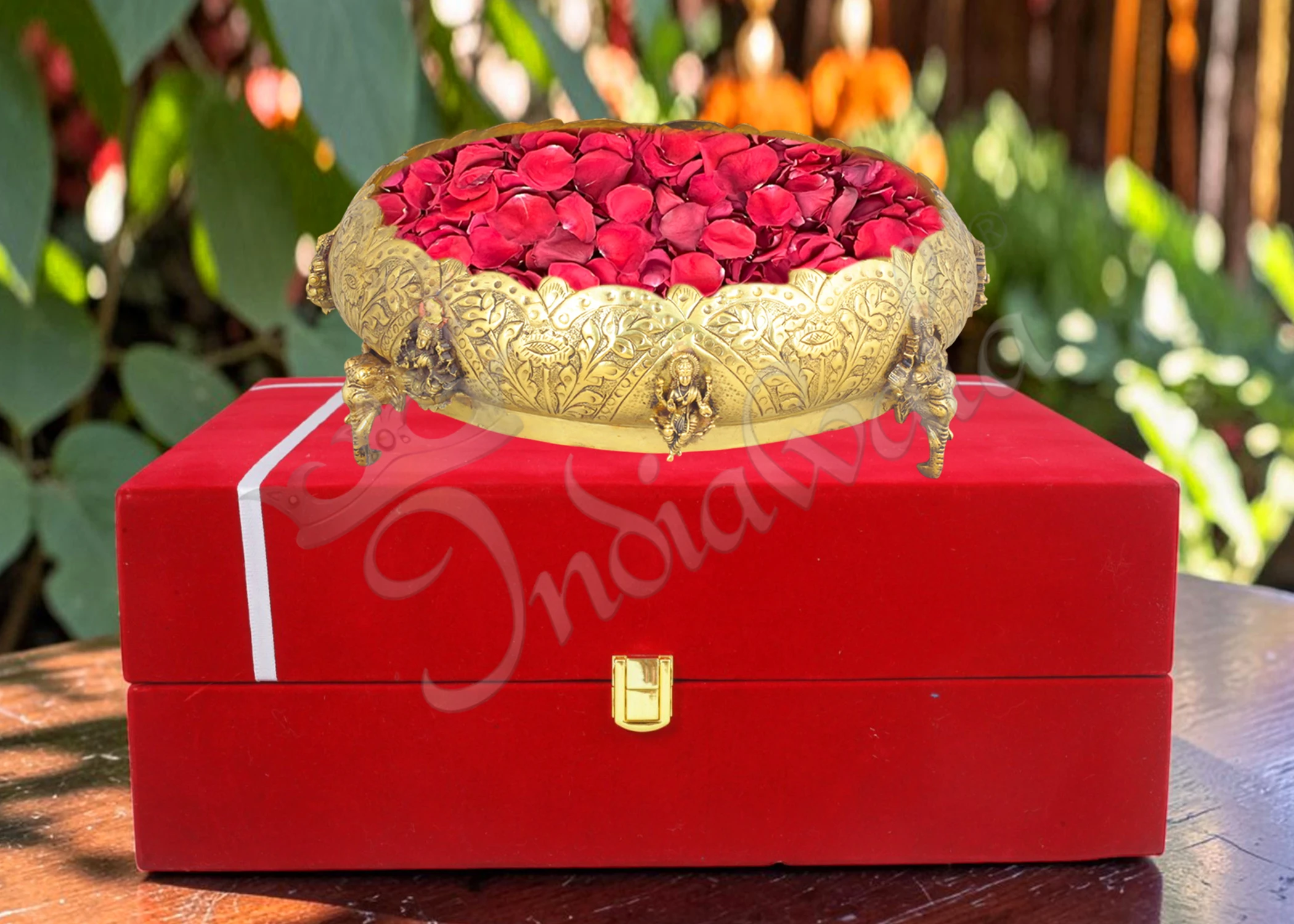 INW-9397 An 11 inch Gold Plated Brass Gifting Urli Pot filled with water and floating flowers.