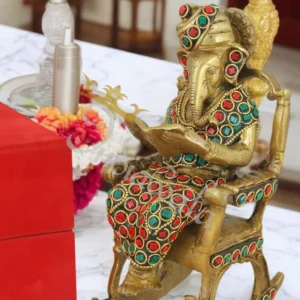 Antique Stone Brass Chair Ganesh idol on a decorative surface