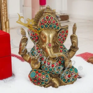 A beautifully crafted 4 inch Antique Stone Brass Ganesh Gifting Statue with intricate details.