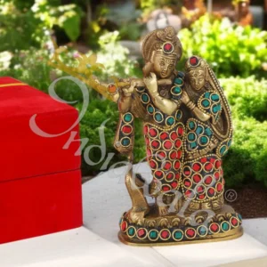 A beautifully handcrafted Brass Radha Krishna Idol with intricate detailing and antique stone finish.