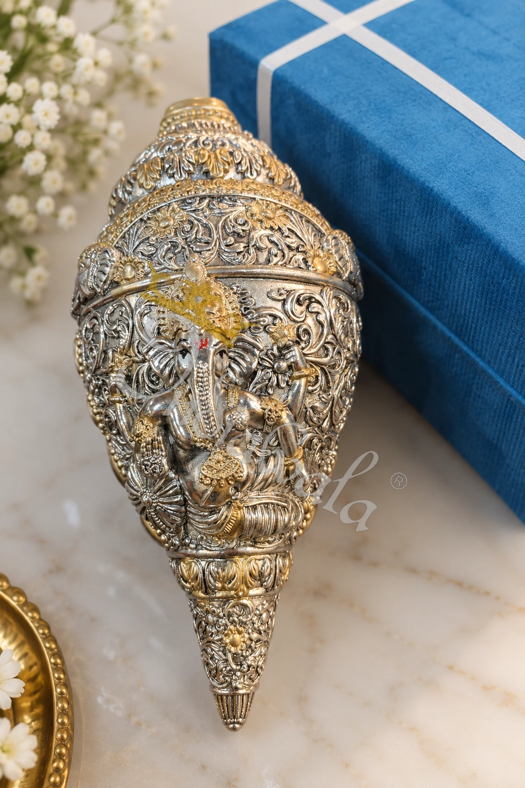 INW-9470 A beautifully crafted 9 inch German Silver Ganesh Shankh Idol, perfect for spiritual decor.