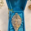 INW-9470_1 A beautifully crafted 9 inch German Silver Ganesh Shankh Idol, perfect for spiritual decor.