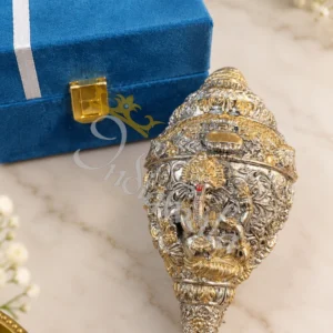 A beautiful 5.5 Inch German Silver Ganesh Pooja Shankh, intricately designed.