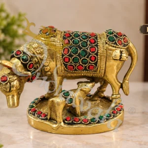 A beautifully crafted Brass Stone Work Kamdhenu Gifting Statue, adorned with colorful stones.