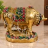 INW-9474_1 A beautifully crafted Brass Stone Work Kamdhenu Gifting Statue, adorned with colorful stones.