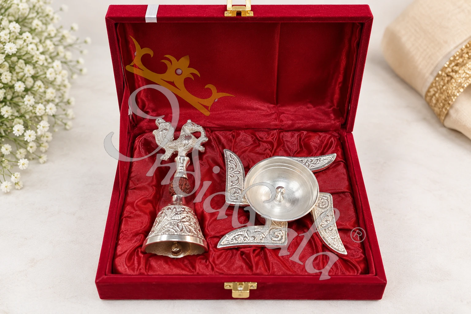 INW-9488_1 German silver swastik diya and peacock bell set in a premium velvet box