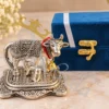 Miniature German Silver Aluminium Cow Figurine in a velvet box for gifting.