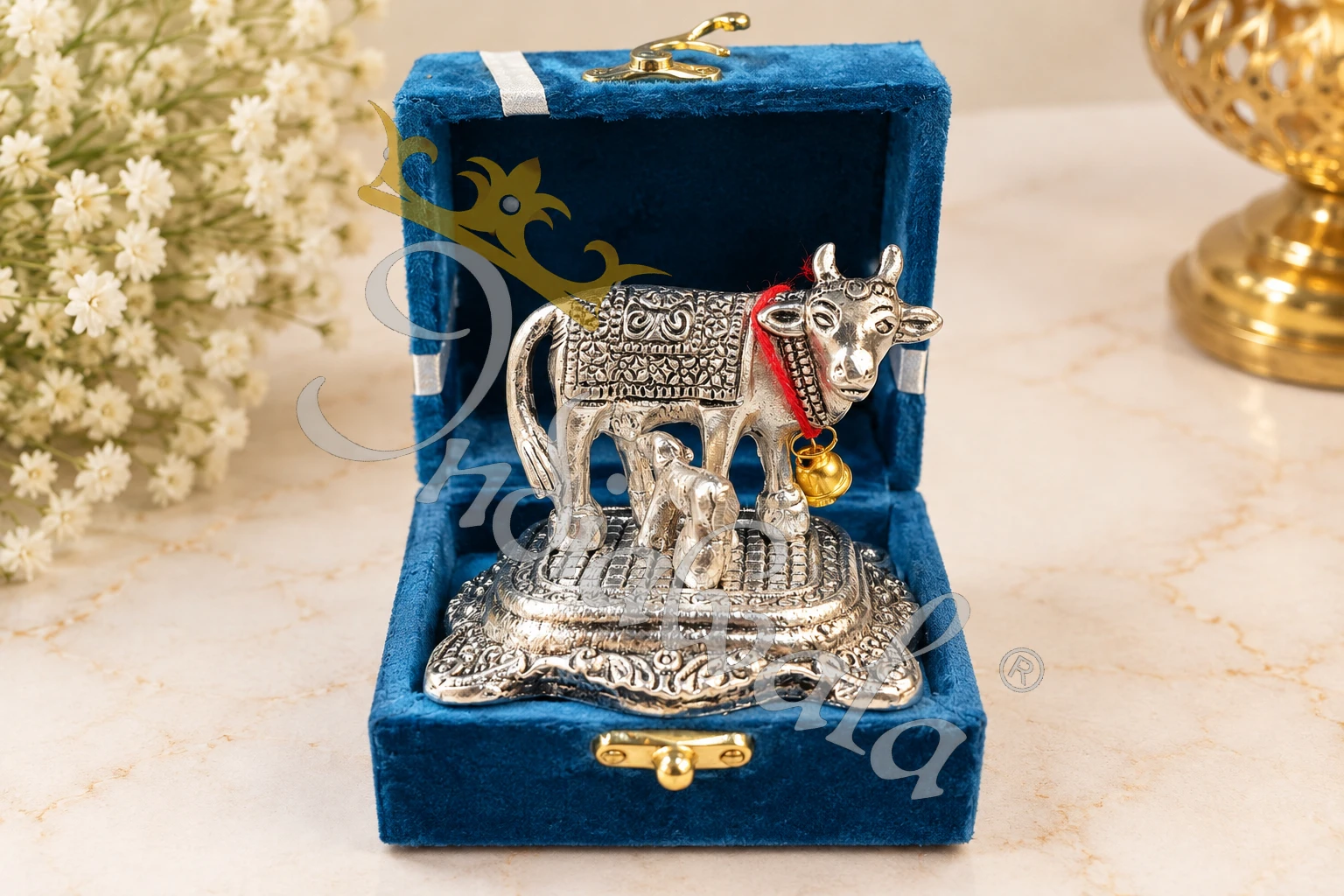 Miniature German Silver Aluminium Cow Figurine in a velvet box for gifting.