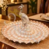 An elegant 8 Inch German Silver Peacock Tray with intricate traditional engravings.